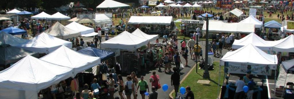 Aerial view of the Germantown Festival with white vendor tents and crowds